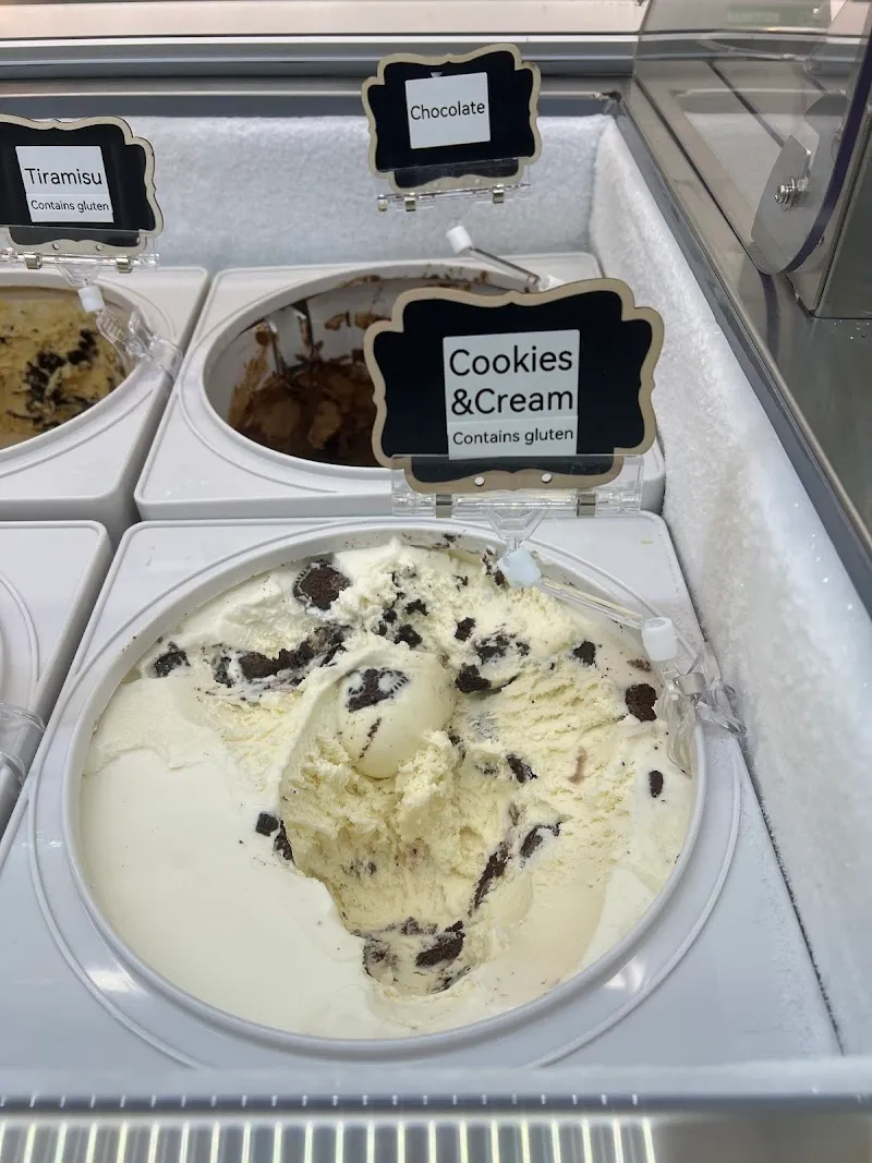 Ice cream flavors in display case with labels